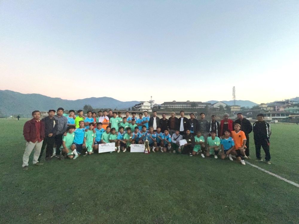 Winning team of the Under-17 Youth League Football Tournament with organizers and others at the Astro Turf Loyem Memorial Ground at Tuensang Town on December 22.